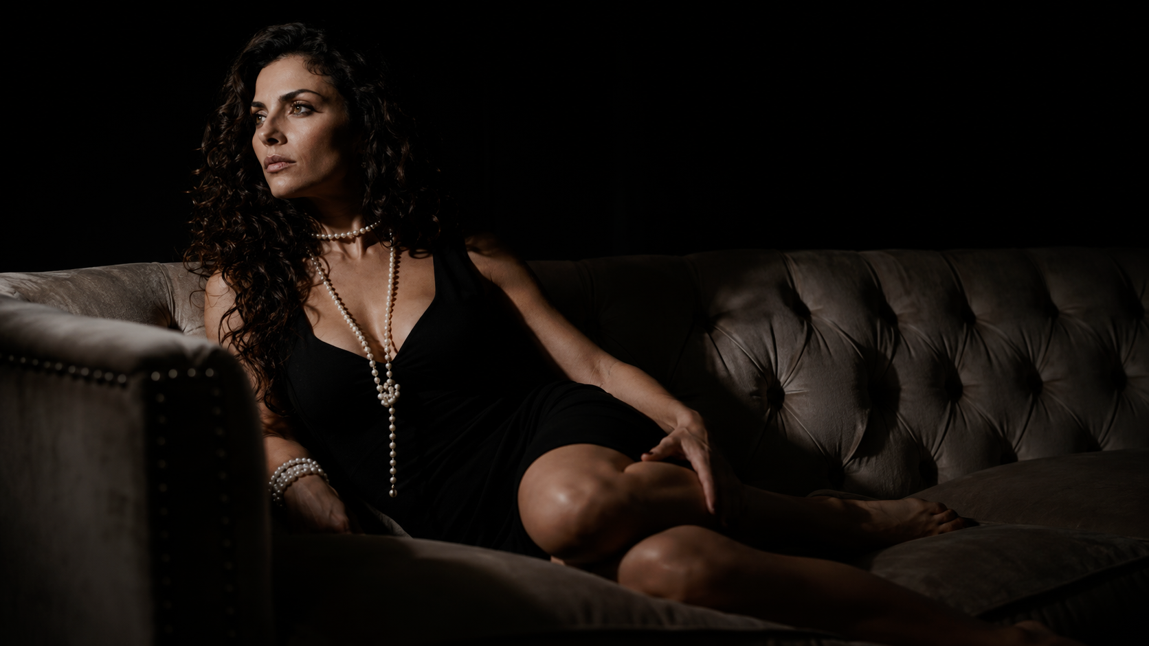Salome on couch — production still